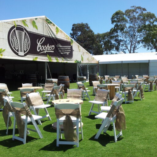 Front-area-of-coopers-retirement-party-with-white-americana-chairs-hessian-sashes-cable-tables-and-pavilion