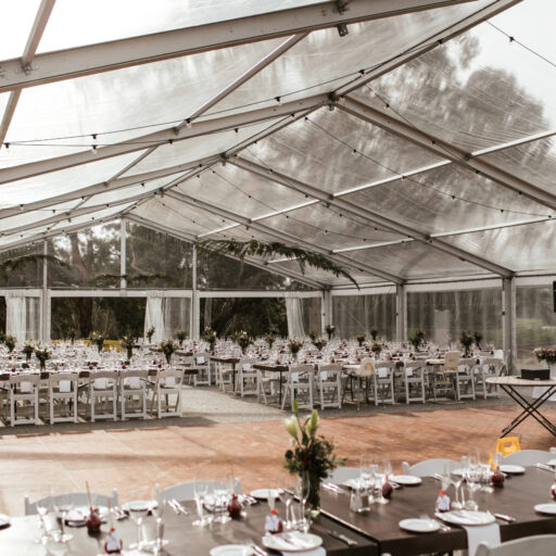 Stained-Timber-Tables-and-Americanas-in-15m-x-30m-Clear-Pavilion-at-Lot-100-for-a-wedding