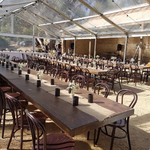 Wedding-10m-x-15m-Clear-Pavilion-with-Festoon-Lights-Stained-Timber-Tables-and-Walnut-Bentwood-Chairs-at-Brooklyn-Farm