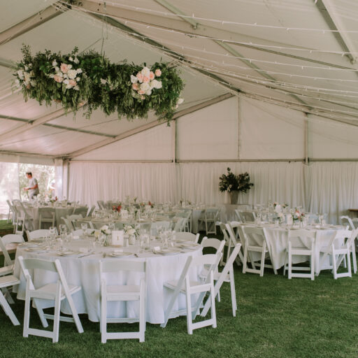 15m-x-25m-pavilion-with-Americana-Chairs-Round-Tables-White-Linen-and-Wall-Lining